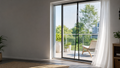 RenterReady magnetic patio screen installed on a bright apartment balcony doorway